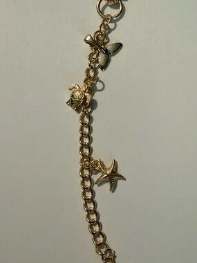 Gold-Tone Sea Life lip gloss / bag Charm  - Gold Color